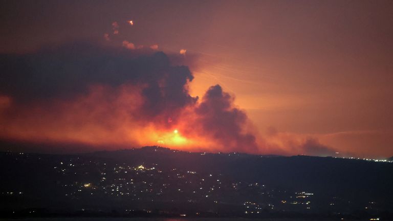 A view shows smoke and fire on the Lebanese side of the border with Israel, after Israel said it had noted armed group Hezbollah preparing to attack Israel and had carried out pre-emptive strikes on Hezbollah targets in Lebanon, as seen from Tyre, southern Lebanon August 25, 2024. REUTERS/Aziz Taher