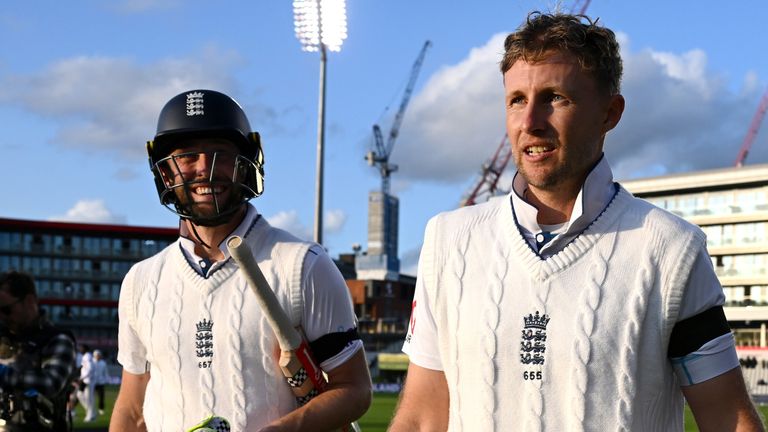 MANCHESTER, ENGLAND - AUGUST 24: Chris Woakes and Joe Root of England celebrate winning the 1st Test Match between England and Sri Lanka at Emirates Old Trafford on August 24, 2024 in Manchester, England. (Photo by Gareth Copley/Getty Images)