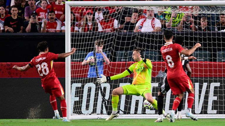 Liverpool's Fabio Carvalho (28) scores a goal past Arsenal goalkeeper Karl Hein, center, during the first half of an international friendly soccer match, Wednesday, July 31, 2024, in Philadelphia. (AP Photo/Derik Hamilton)