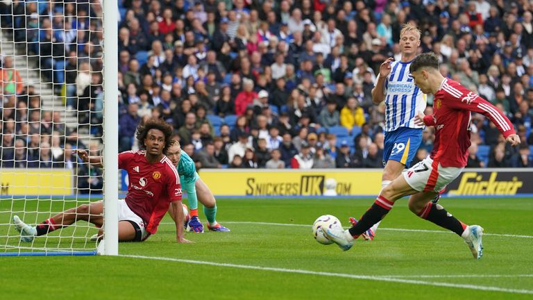 Alejandro Garnacho shoots into the net but his effort deflects off his team-mate Joshua Zirkzee in an offside position