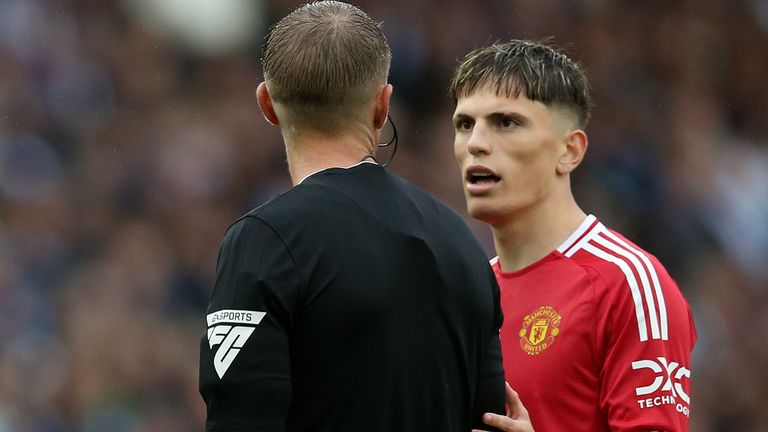 Referee Craig Pawson speaks to Craig Pawson as VAR reviews the Manchester United forward's strike